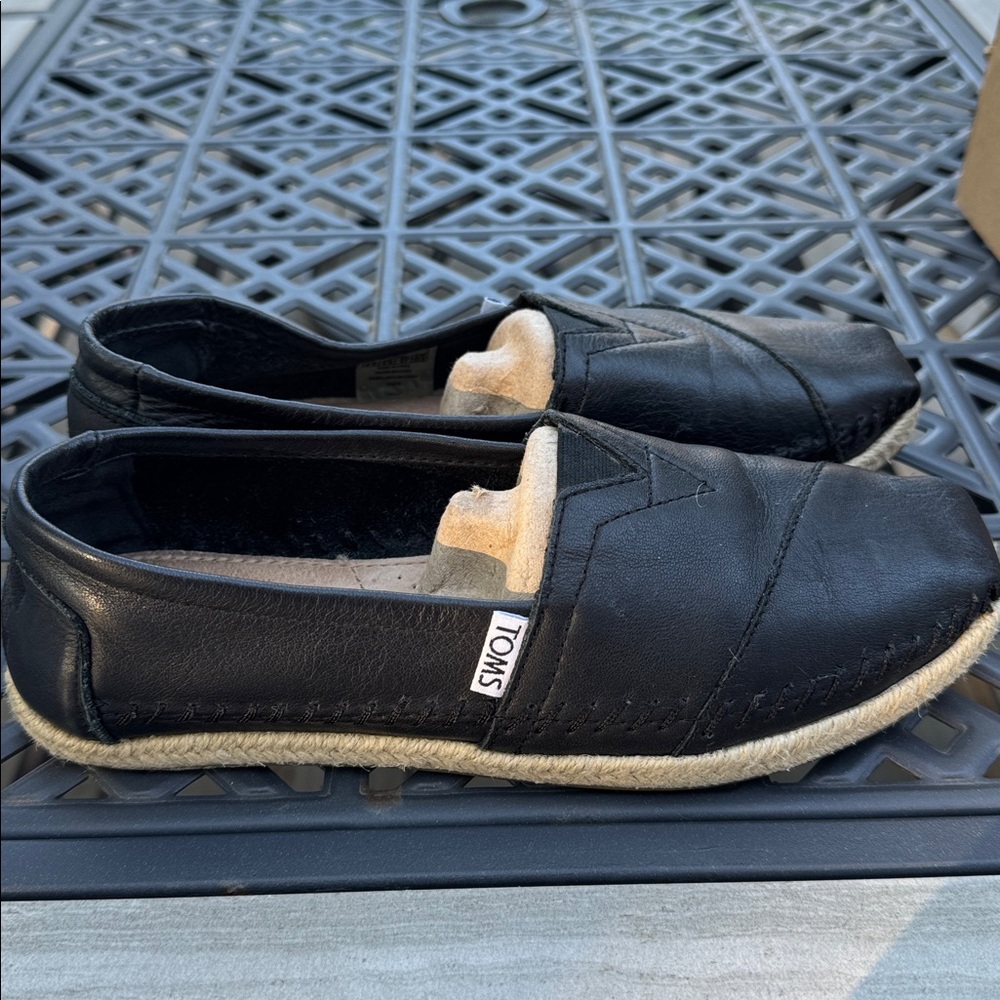 TOMS Classic Black Leather Slip-Ons